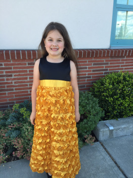 girl in gold flower dress